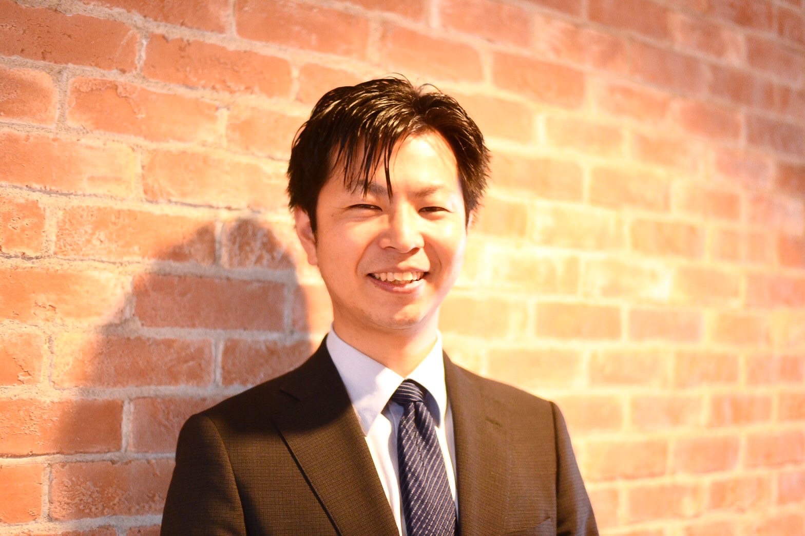 代表鵜飼晃臣写真